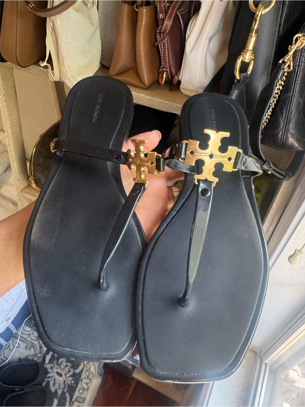 Tory Burch Black Thong Sandals with Gold Logo Accent